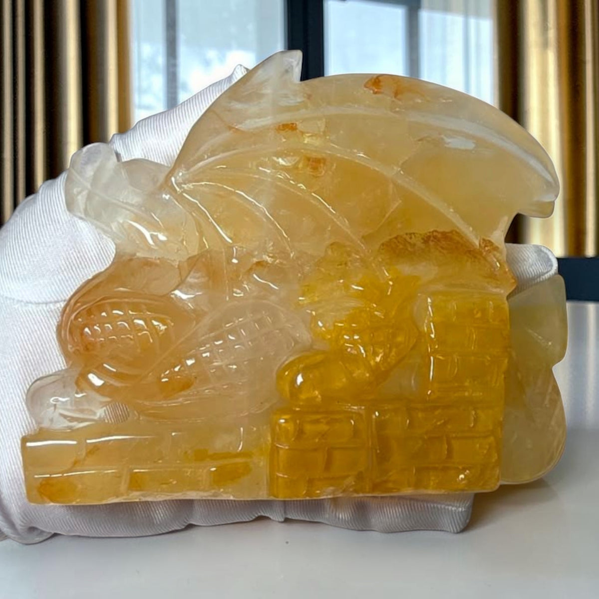 Close view of Golden Healer Quartz dragon carving
