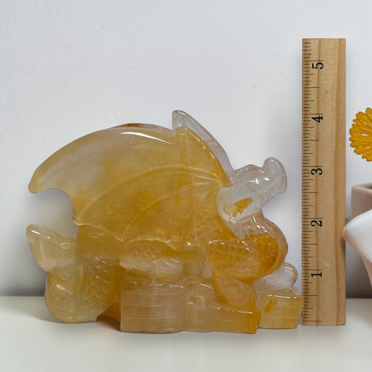 Quartz dragon beside vertical ruler showing approximate height
