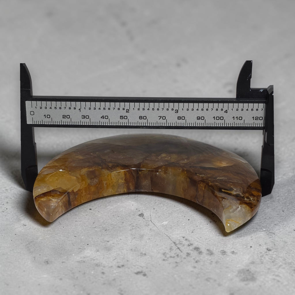 Golden healer crescent moon sculpture on gold stand with size measurement