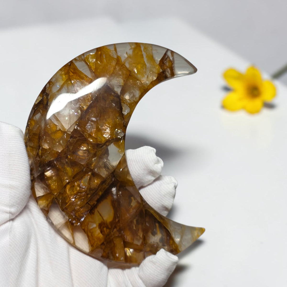 Golden healer crescent moon crystal close up detail