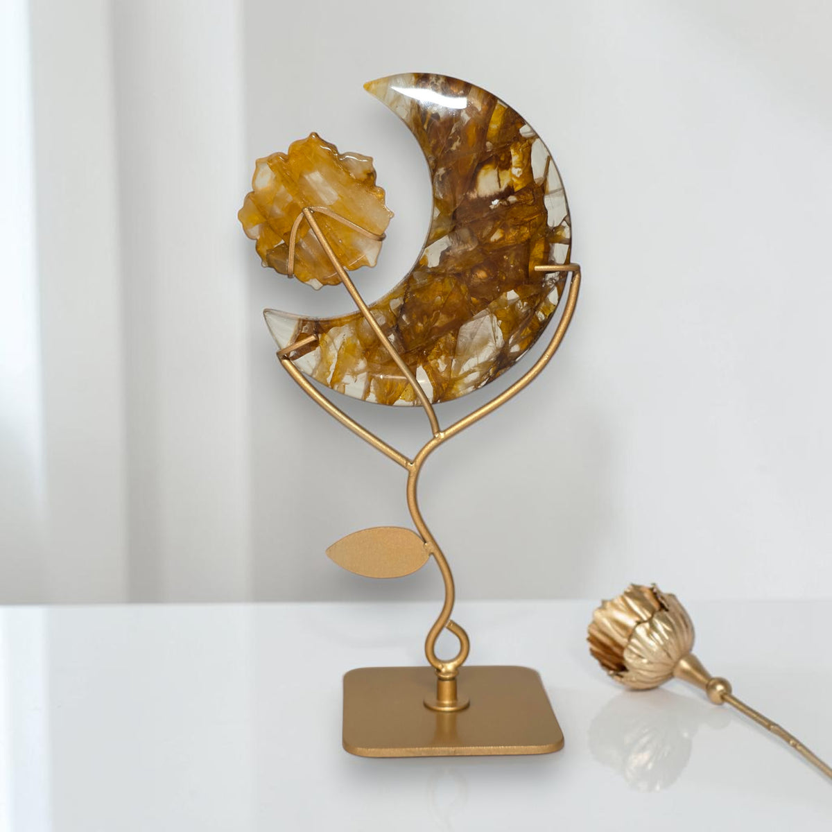 Golden healer crescent moon sculpture full view on gold stand