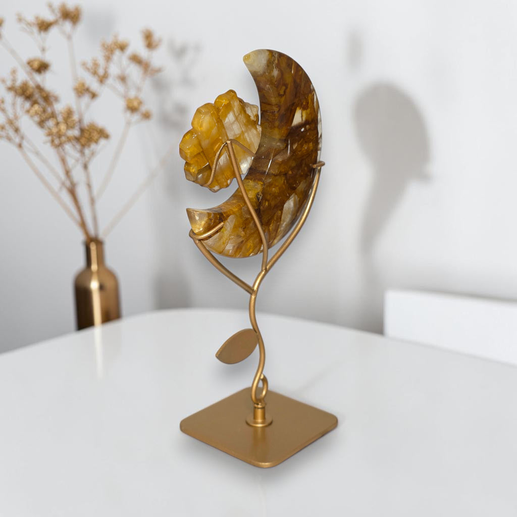 Golden healer crescent moon sculpture side view on gold stand