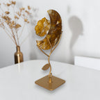 Golden healer crescent moon sculpture side view on gold stand