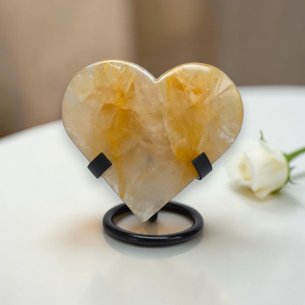 Heart-shaped stone on a stand with a blurred background