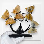 Golden Healer quartz butterfly tree held in a hand for scale