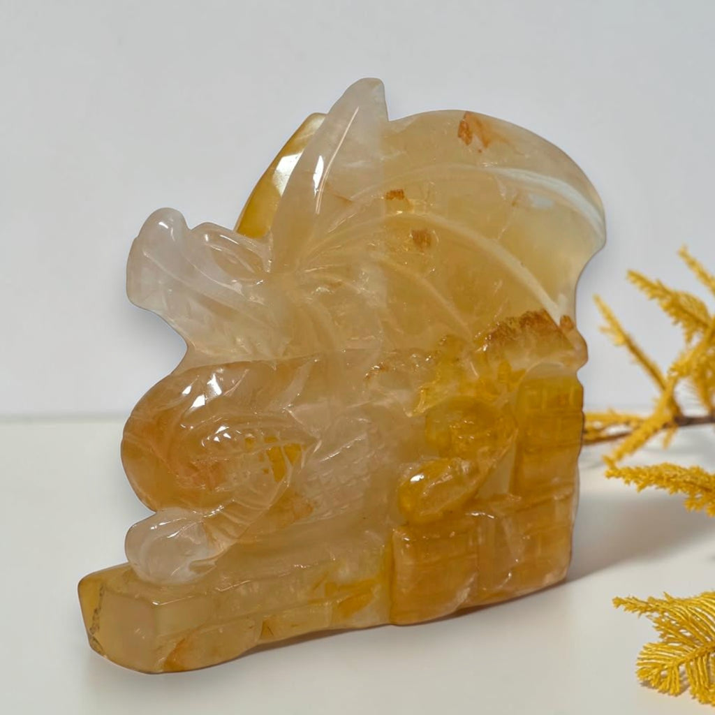 Angled view of polished Golden Healer Quartz dragon