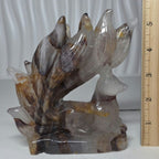 Golden Healer Quartz nine tailed fox carving next to ruler showing 5.5 inch height