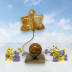 Golden Healer Quartz orchid flower carving on gold stand with wildflowers display