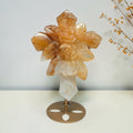 Golden Healer quartz rose cross on a gold toned display stand