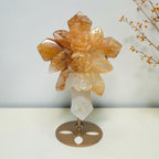 Golden Healer quartz rose cross on a gold toned display stand