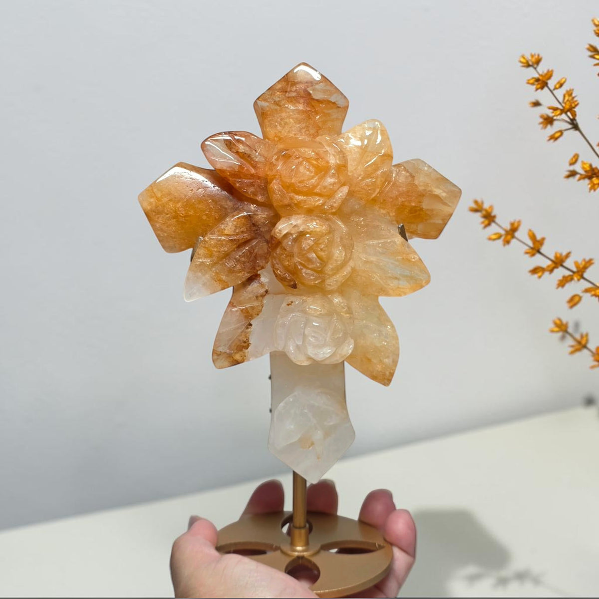 Front view of Golden Healer quartz cross with sculpted roses and leaves