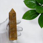 Golden Healer Quartz tower next to ruler showing 5 inch height