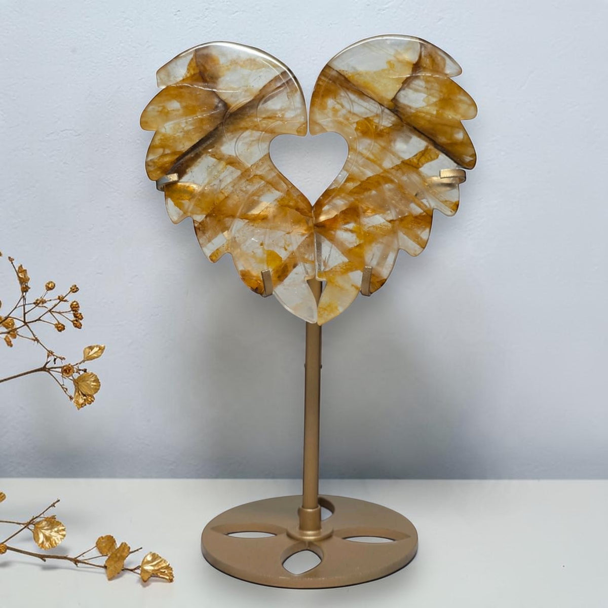 Golden Healer quartz angel wings forming a heart on a gold toned stand