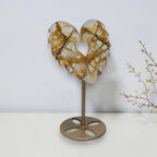 Angled view of the Golden Healer quartz angel wing heart