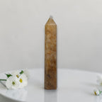 Golden quartz tower with pointed crystal top, amber/gold, vertical display