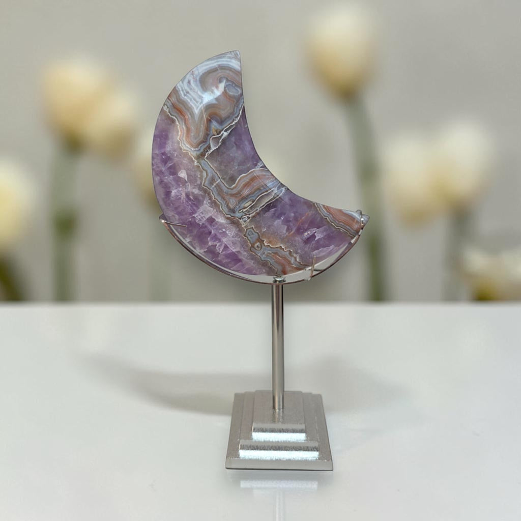Purple banded agate crescent moon on silver metal display stand