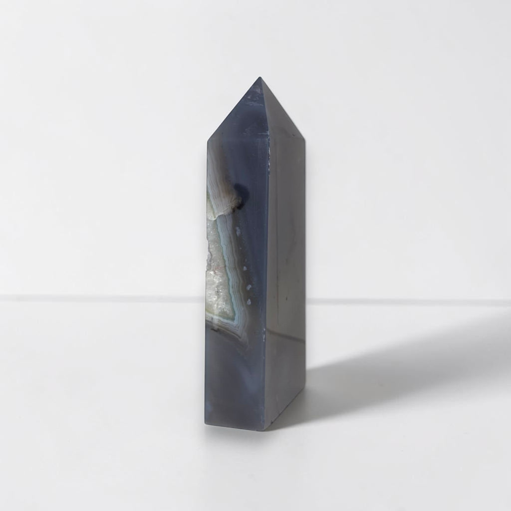 Geometric crystal tower on a white background