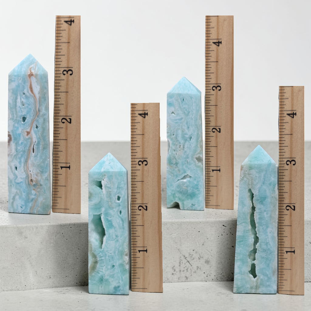 Size comparison of hemimorphite crystal towers next to ruler, 3 to 4 inches