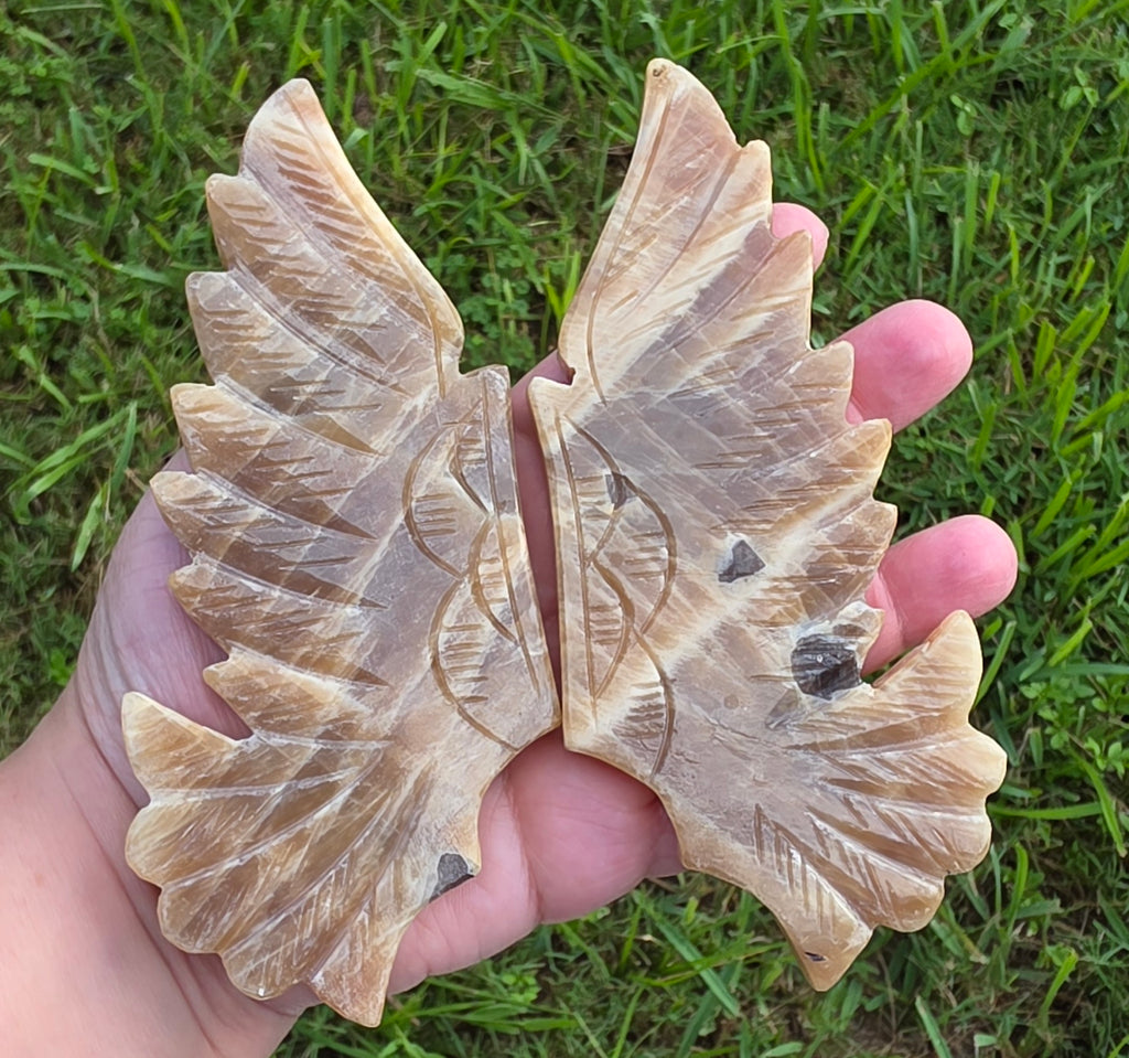 Close view of Honey Calcite wing carvings and stone patterns