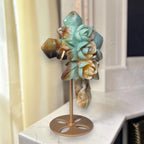 Amazonite crystal cross with carved roses on gold-tone circular base