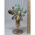 Amazonite crystal cross with carved roses, shown beside measuring ruler