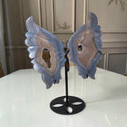 Blue agate butterfly wings crystal sculpture with black stand, angled view