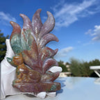 Ocean jasper nine-tail fox crystal carving with multicolor leaf-like tails on cloth