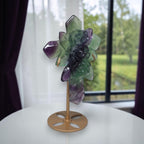 Rainbow fluorite cross sculpture with carved rose details on gold-toned metal base