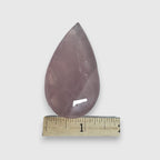 Rose quartz teardrop crystal with ruler measuring length