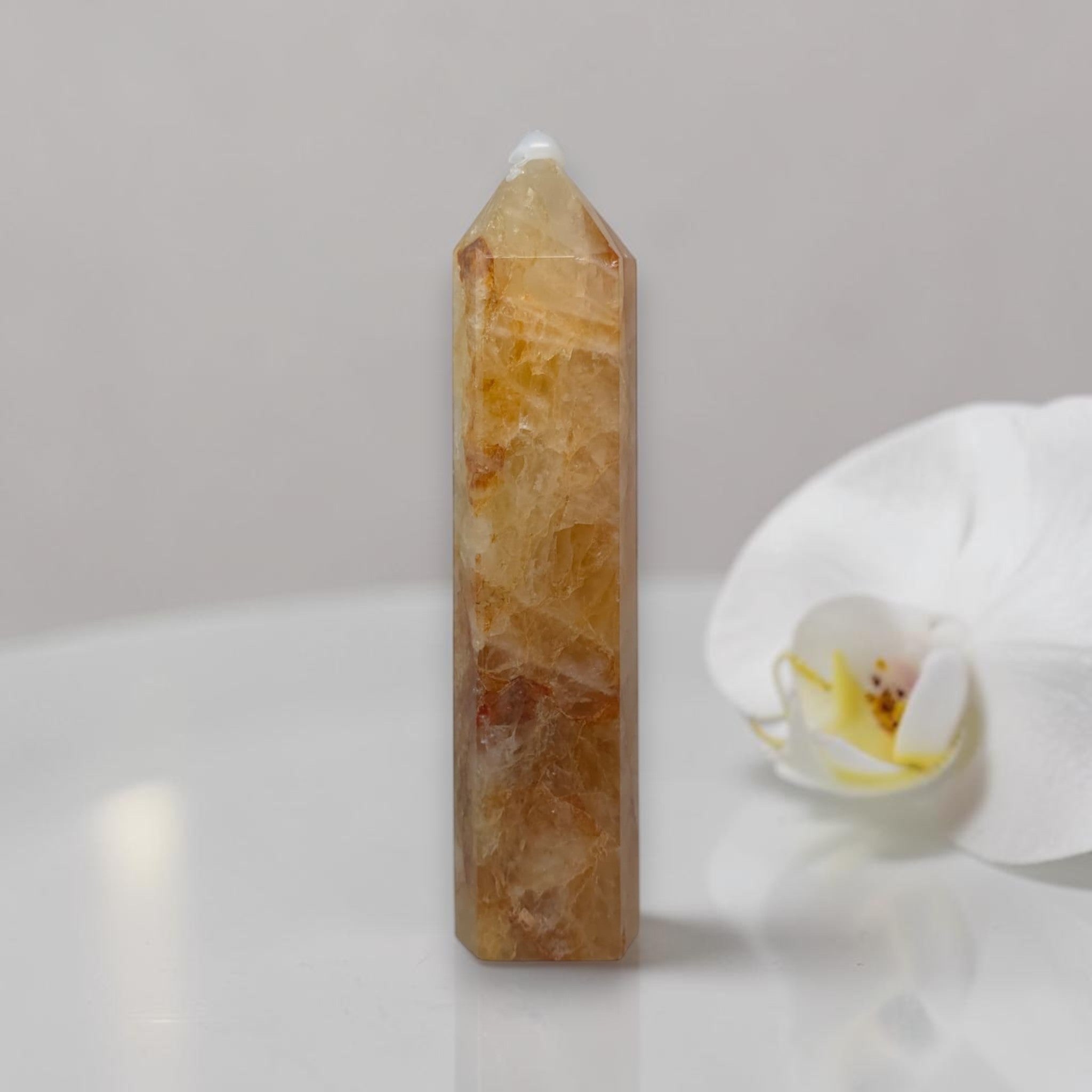 Golden Healer quartz tower crystal point, faceted translucent golden tower with tip.