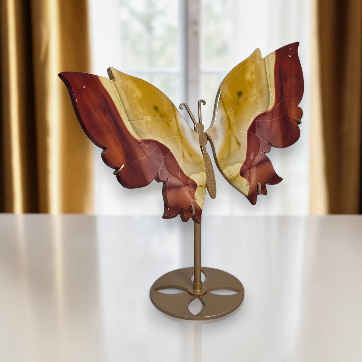 Side view of the Mookaite jasper butterfly carving