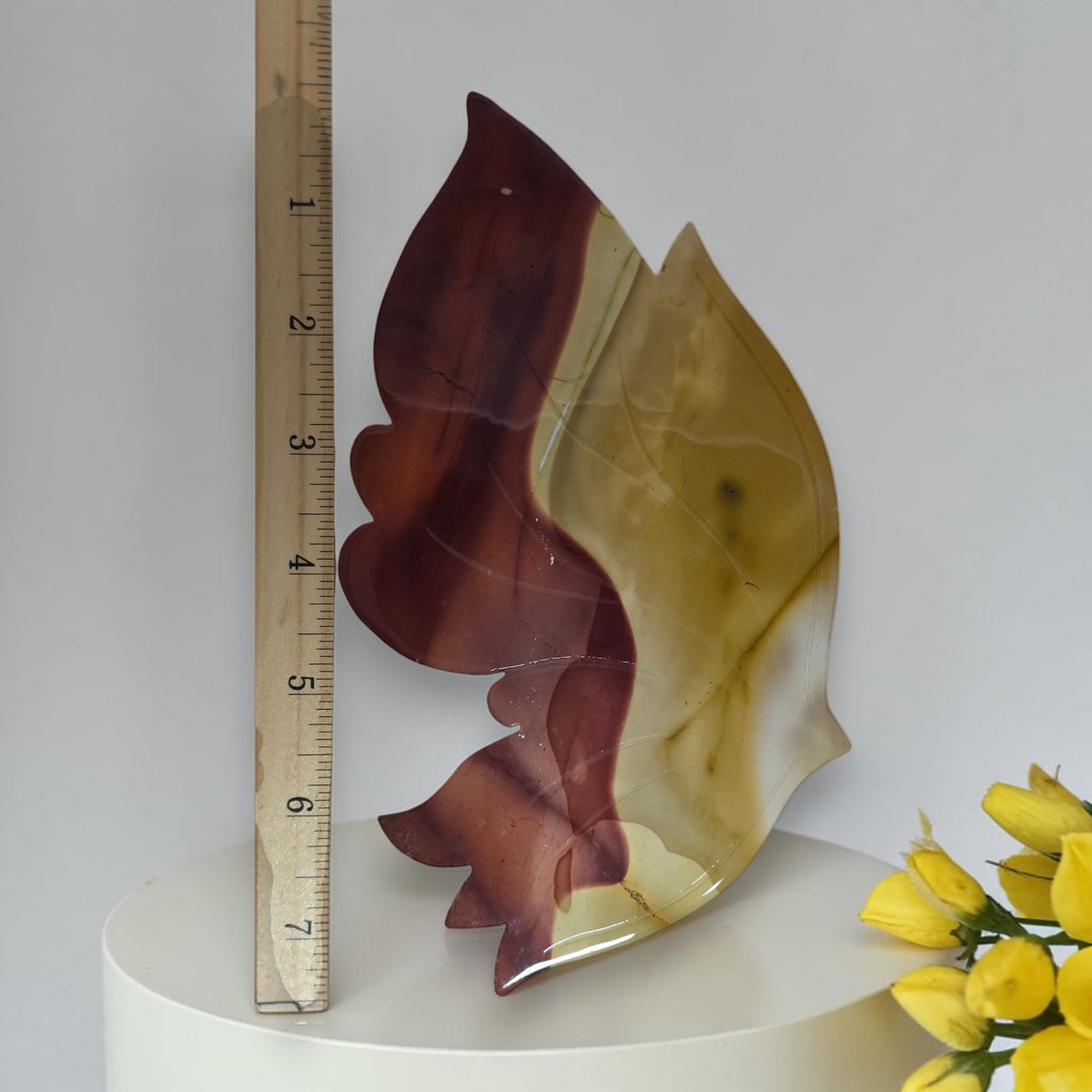 Mookaite jasper butterfly carving displayed front-facing on its metal stand