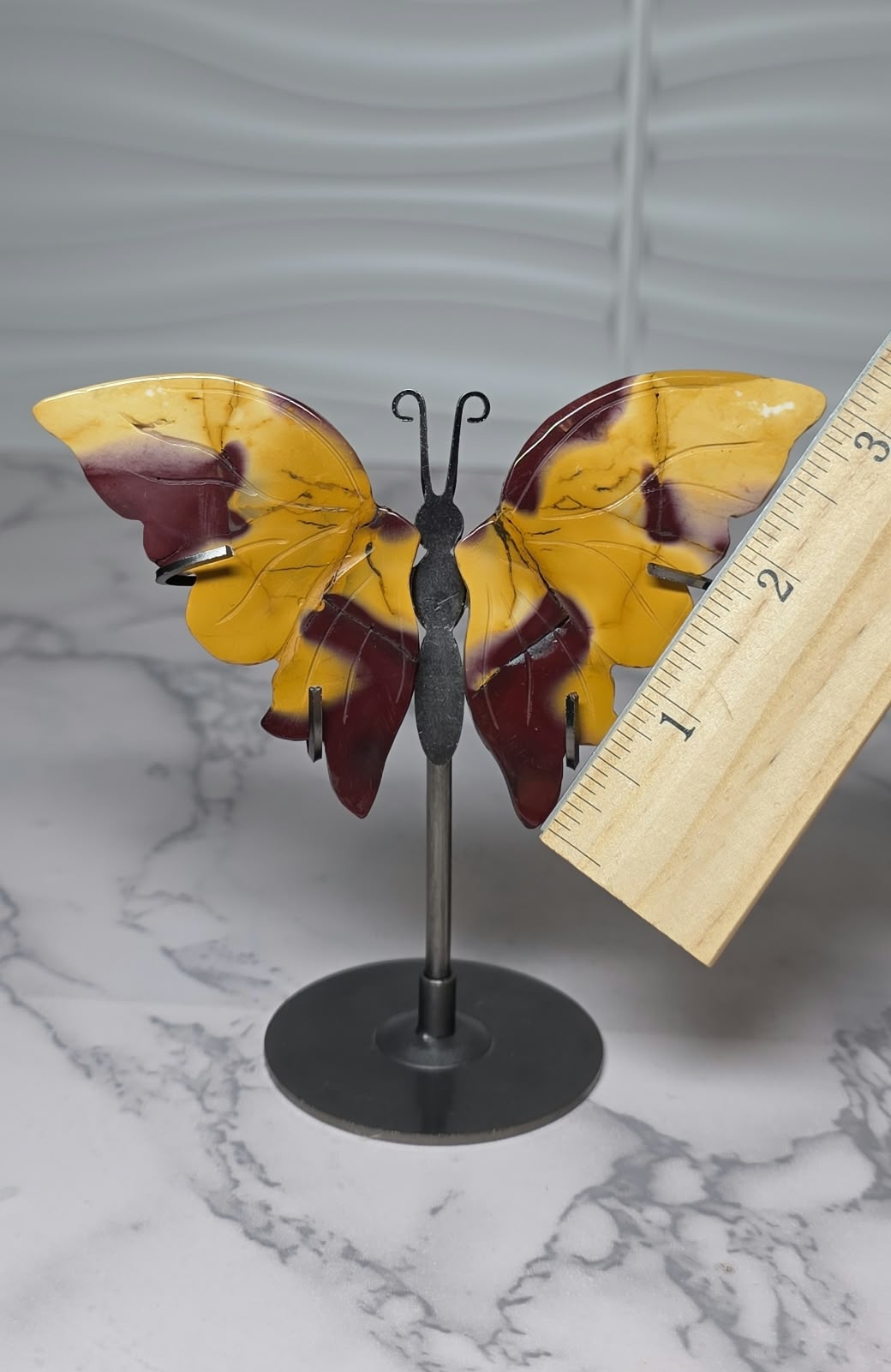 Mookaite Jasper butterfly display with ruler beside the wing