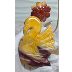 Closeup of polished Mookaite Jasper swan carving