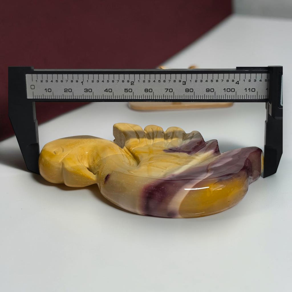 Mookaite Jasper swan carving shown with measuring tool
