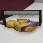 Mookaite Jasper swan carving shown with measuring tool