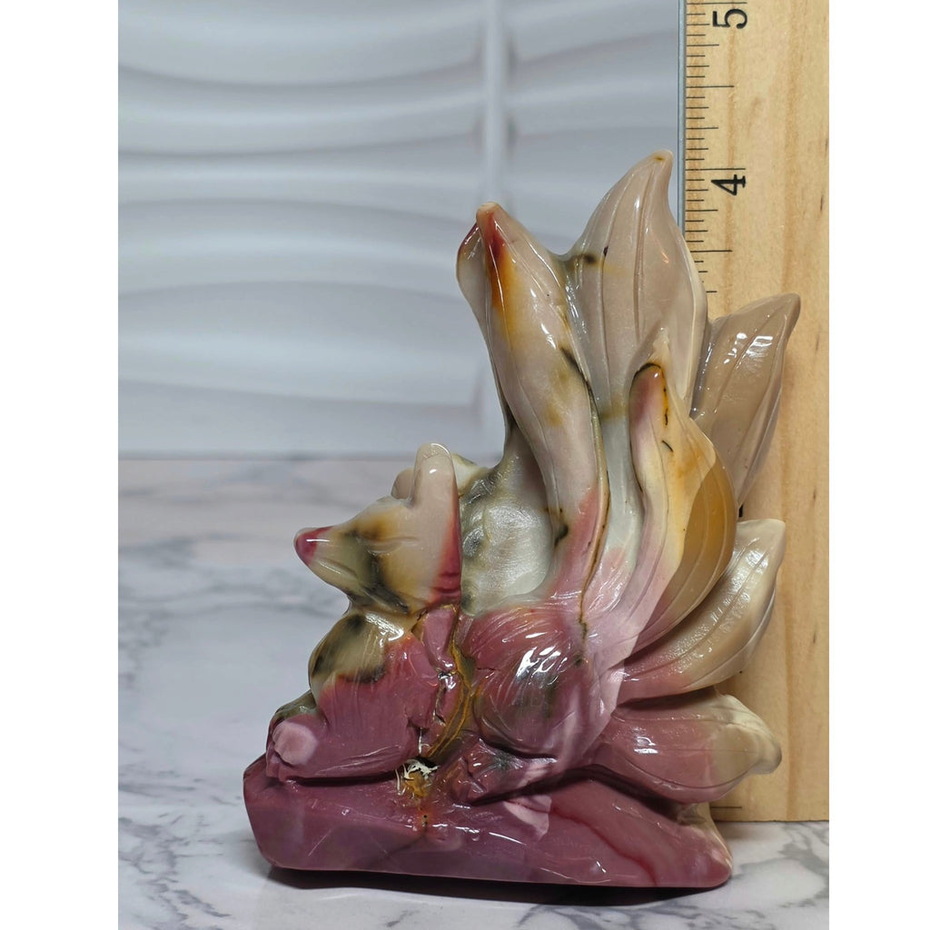 Mookaite nine tails fox carving beside a ruler