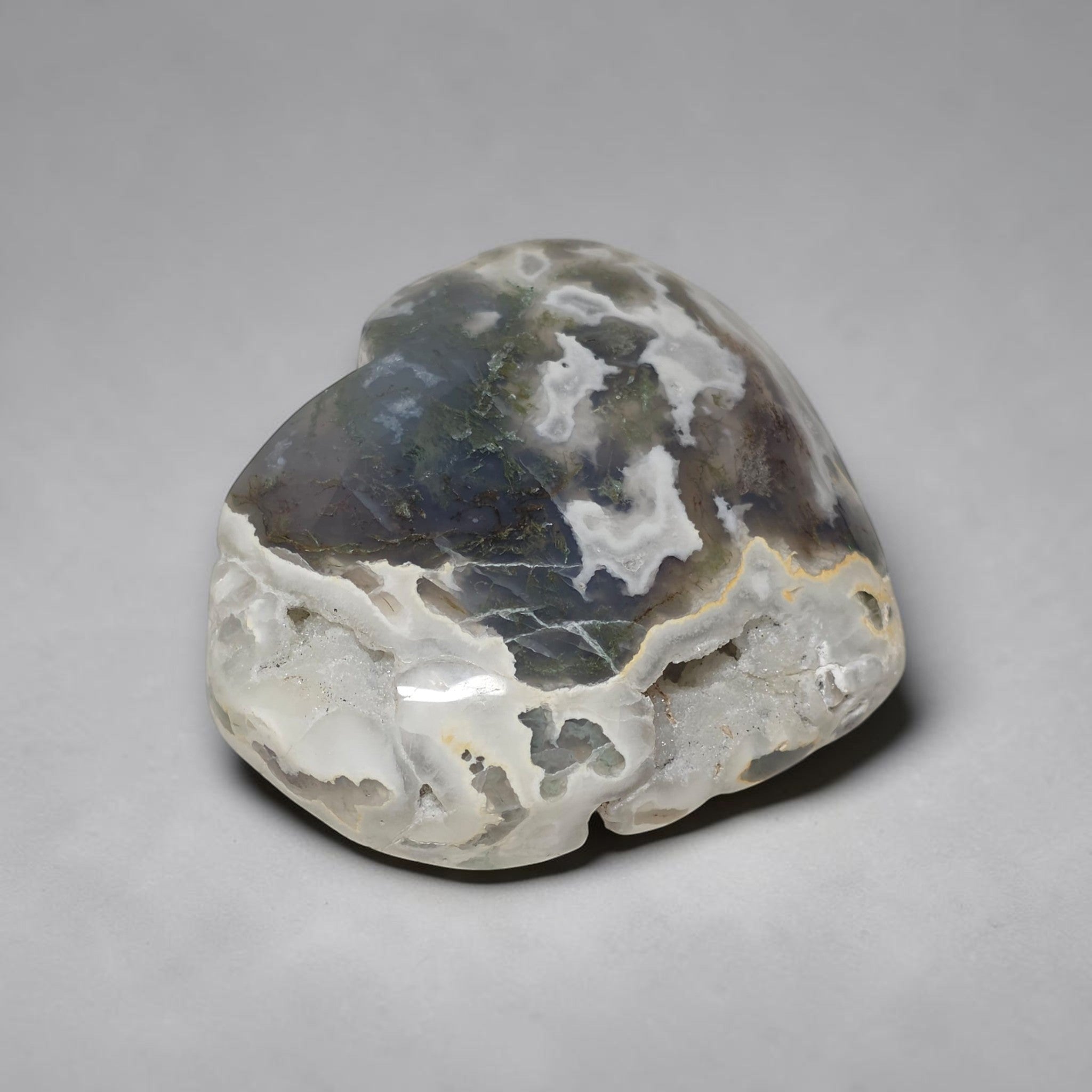 Polished stone with white and gray patterns on a gray background