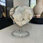 Heart-shaped stone on a stand with a blurred background