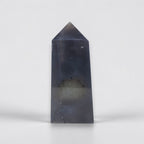 Tall, dark gray crystal pyramid on a white background