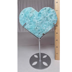 Hemimorphite heart on display stand with ruler for scale