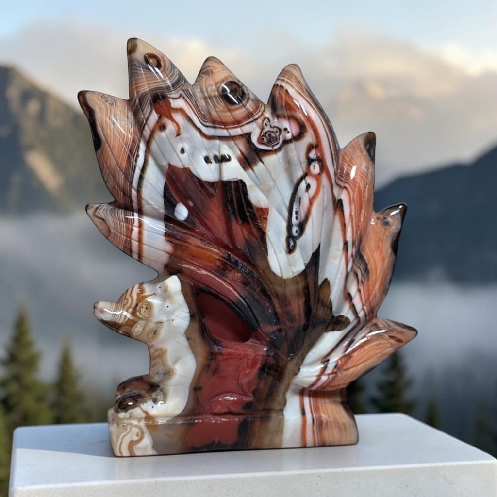 Banded Agate Nine Tails Fox Kitsune carving angle view with mountain background