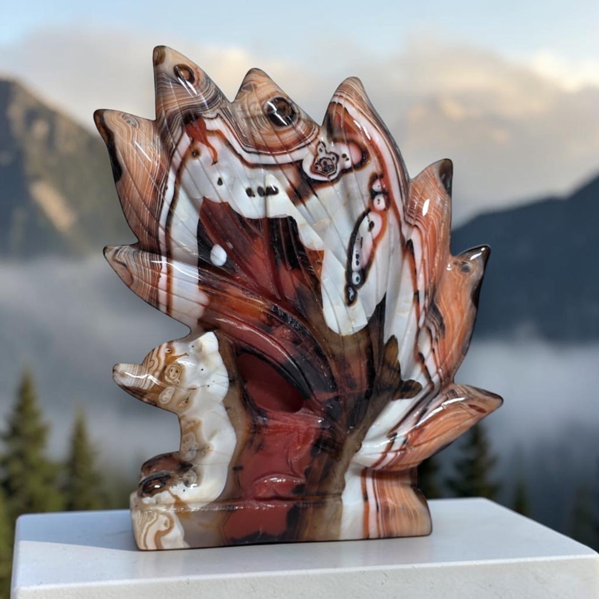 Banded Agate Nine Tails Fox Kitsune carving angle view with mountain background