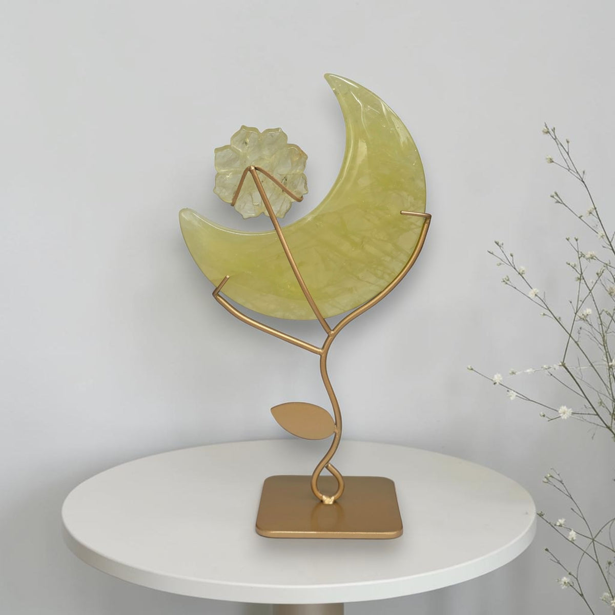 Citrine crescent moon with carved flower on gold tone stand, front view