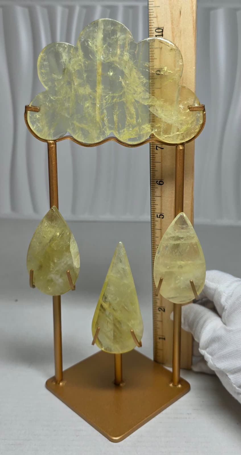 Crystal cloud sculpture with yellow teardrop crystals; height scale ruler beside base