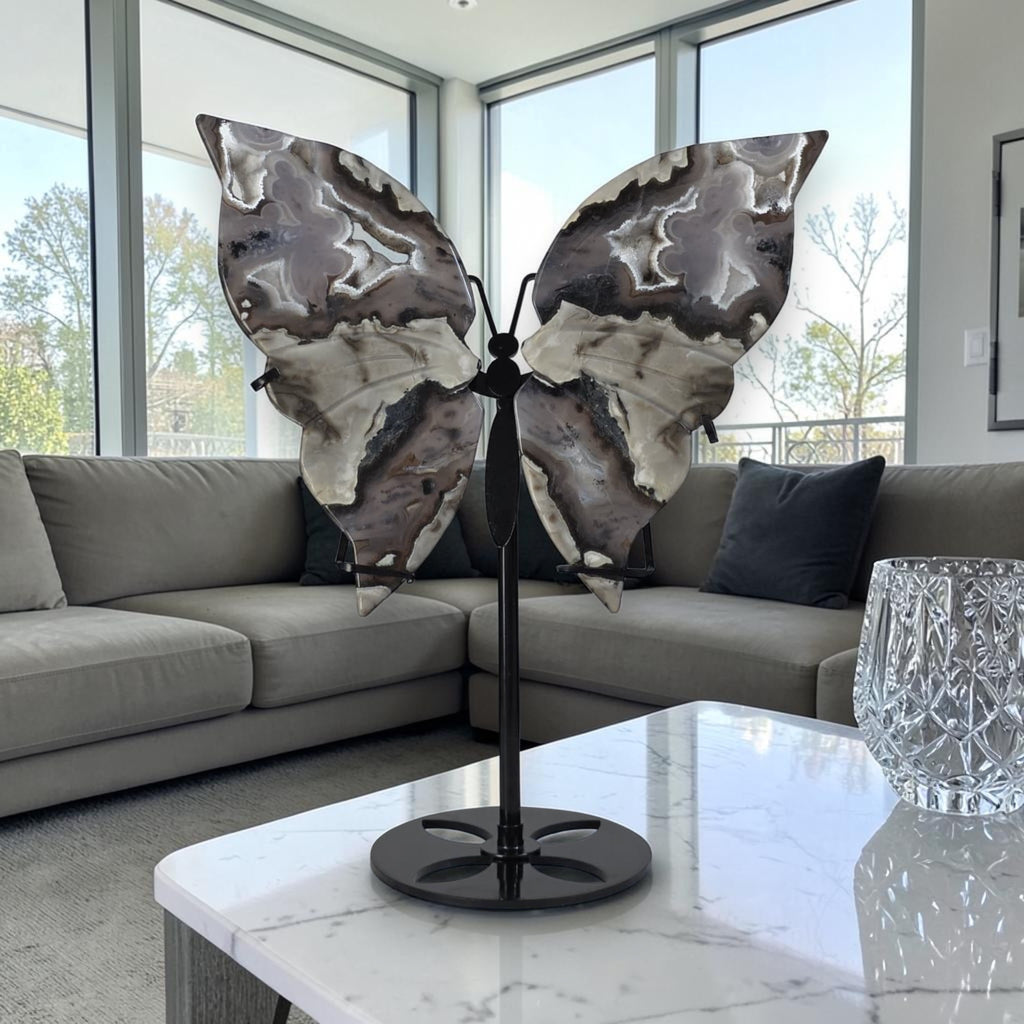 Butterfly sculpture on a stand in a modern living room