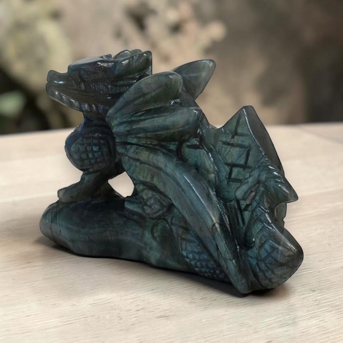Side view of the smoky gray labradorite dragon carving