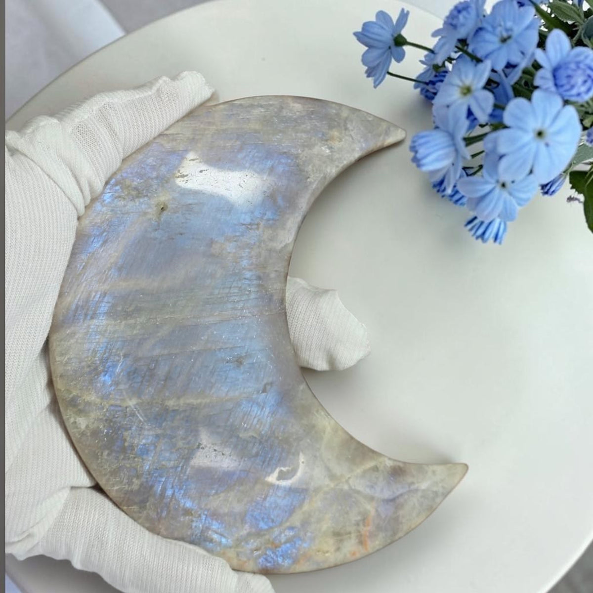 Natural moonstone crescent moon showing blue flash