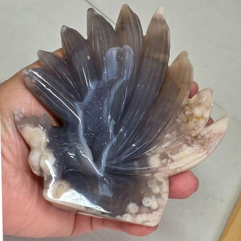 Flower Agate Nine Tails Fox held in hand showing druzy detail