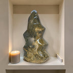 Flame-shaped ocean jasper healing stone, polished dark green with gold mottling